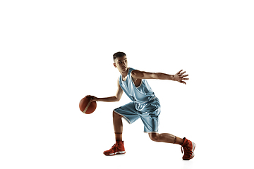 Image showing Full length portrait of a young basketball player with ball