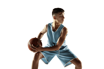 Image showing Full length portrait of a young basketball player with ball