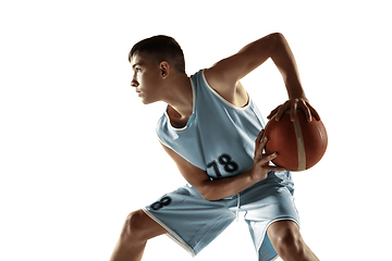 Image showing Full length portrait of a young basketball player with ball