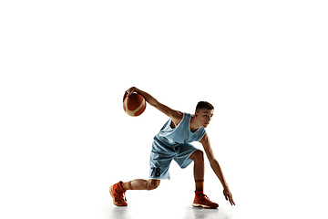 Image showing Full length portrait of a young basketball player with ball