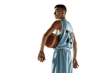 Image showing Full length portrait of a young basketball player with ball