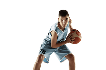 Image showing Full length portrait of a young basketball player with ball