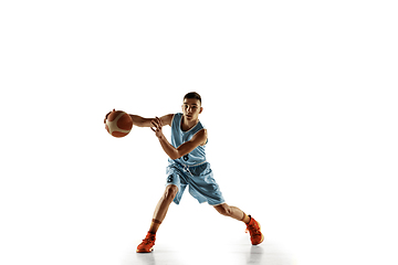 Image showing Full length portrait of a young basketball player with ball