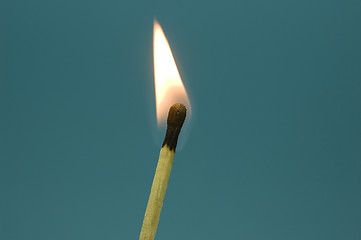 Image showing A burning match