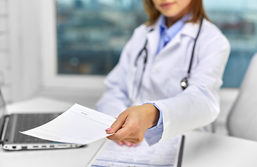 Image showing close up of doctor with prescription at hospital