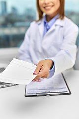 Image showing close up of doctor with prescription at hospital