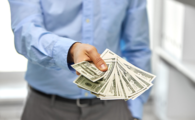 Image showing close up of businessman with american dollar money