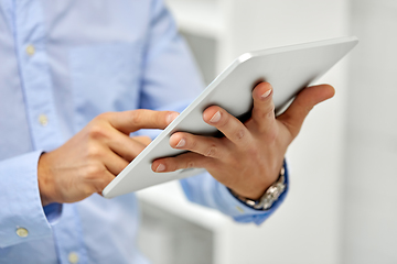 Image showing close up of male hands with tablet pc computer