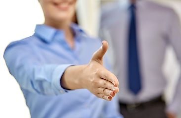 Image showing businesswoman making handshake at office