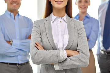 Image showing close up of smiling business people at office