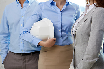Image showing close up of business team with hard hat