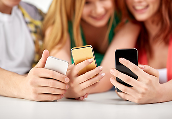 Image showing close up of hands with smartphones