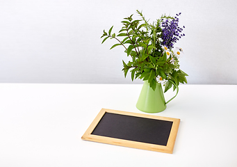 Image showing bunch of herbs and flowers with chalkboard