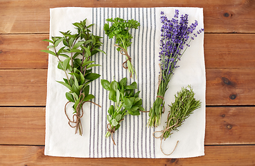 Image showing greens, spices or medicinal herbs on towel