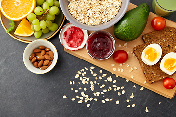 Image showing oatmeal, fruits, toast bread, egg, jam and milk