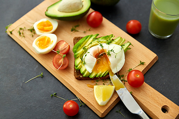 Image showing toast bread with avocado, eggs and cherry tomatoes