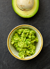 Image showing close up of mashed avocado in ceramic bowl