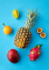 Image showing pineapple with other fruits on blue background