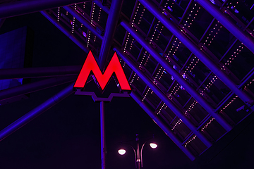 Image showing Bright red Metro entrance sigh in the Moscow at nigh