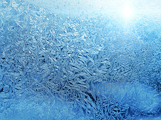 Image showing Beautiful ice pattern and sunlight close-up on winter glass