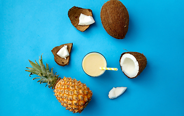 Image showing pineapple, coconut and drink with paper straw