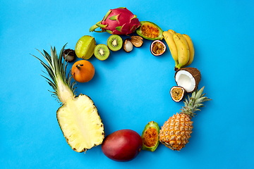 Image showing different exotic fruits on blue background