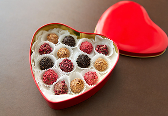 Image showing candies in red heart shaped chocolate box