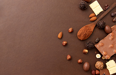 Image showing chocolate with nuts, cocoa beans and powder