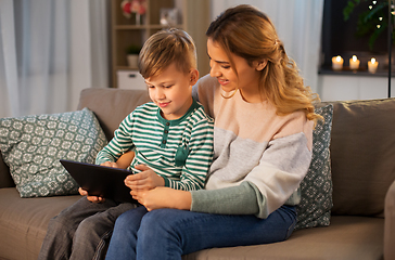 Image showing mother and son using tablet computer at home