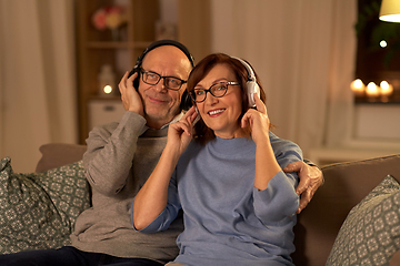 Image showing senior couple with headphones listening to music
