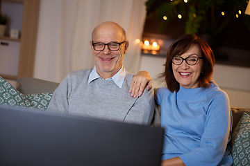 Image showing happy senior couple watching tv at home