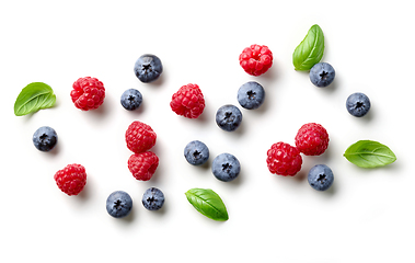 Image showing composition of fresh berries and green leaves