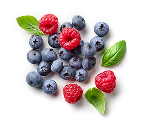 Image showing composition of fresh berries and green leaves