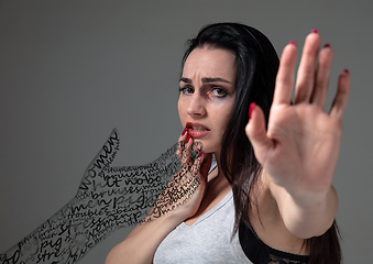 Image showing Woman in fear of domestic abuse and violence, concept of female rights