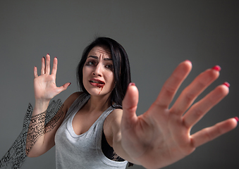 Image showing Woman in fear of domestic abuse and violence, concept of female rights