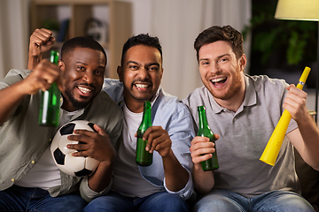 Image showing friends or soccer fans with ball and beer at home