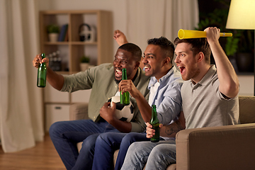 Image showing friends or soccer fans with ball and beer at home