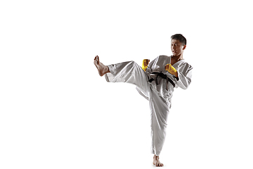 Image showing Confident korean man in kimono practicing hand-to-hand combat, martial arts