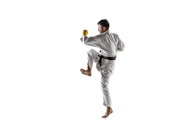 Image showing Confident korean man in kimono practicing hand-to-hand combat, martial arts