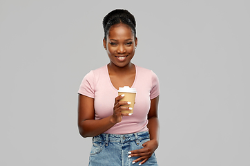 Image showing happy african american woman drinking coffee