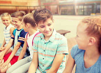 Image showing group of happy elementary school students talking