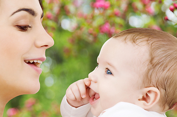 Image showing mother with baby over spring garden background