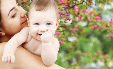 Image showing mother with baby over spring garden background