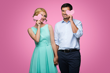 Image showing Beautiful couple holding pink hearts