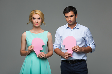 Image showing Beautiful couple holding pink broken heart