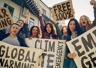 Image showing Young people protesting of climate emergency on the street