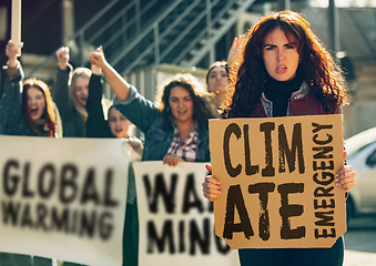 Image showing Young people protesting of climate emergency on the street