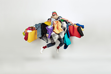 Image showing Man addicted of sales and clothes, overproduction and crazy demand
