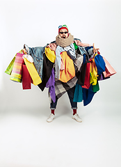 Image showing Man addicted of sales and clothes, overproduction and crazy demand