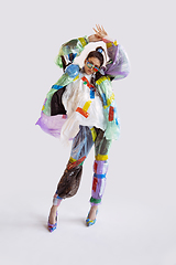 Image showing Woman addicted of sales and clothes, wearing plastic, recycling 